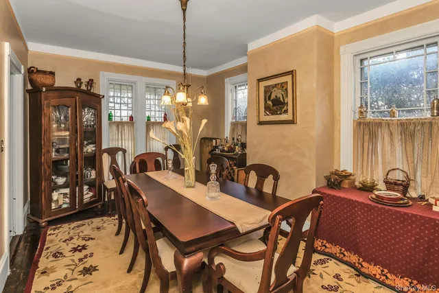 a view of a dining room with furniture and window