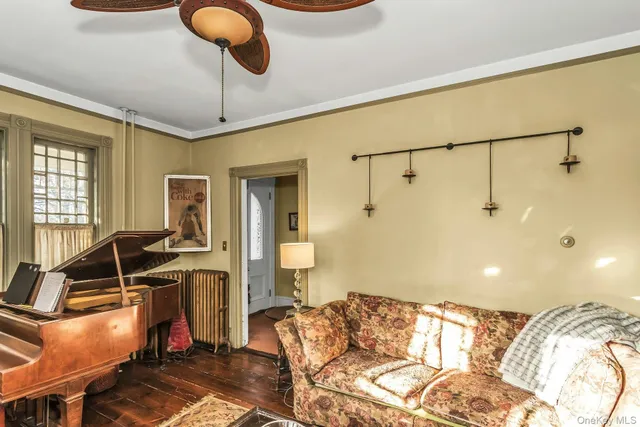 a view of a livingroom with furniture and windows