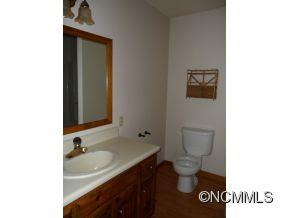 28 Spring Lane Clyde, NC 28721 - Photo 12 of 20 a bathroom with a sink and a toilet