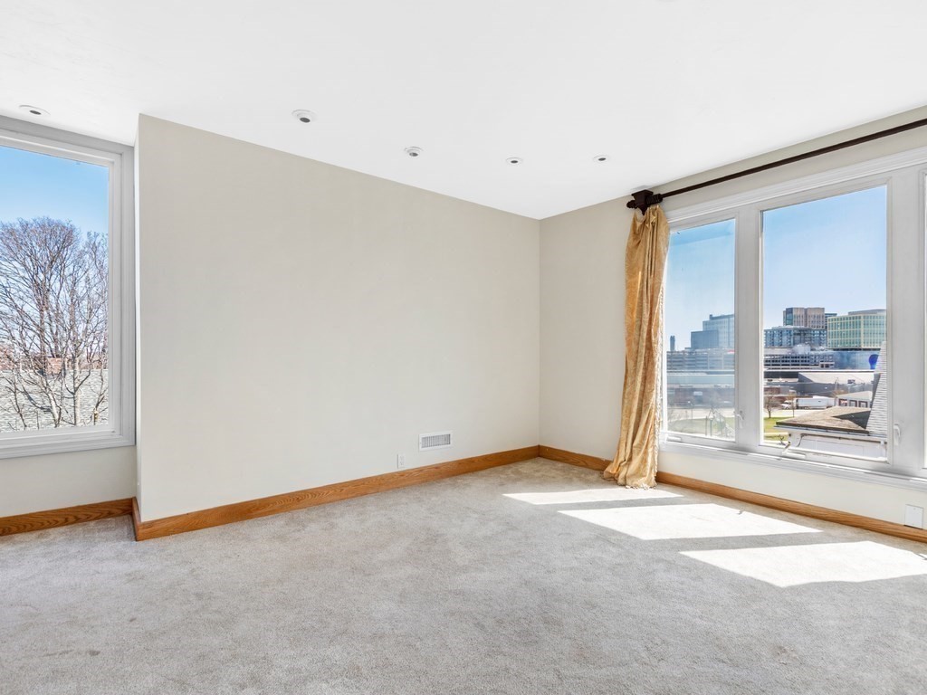 16 Putnam Road Somerville, MA 02145 - Photo 13 of 23 a view of an empty room with a window