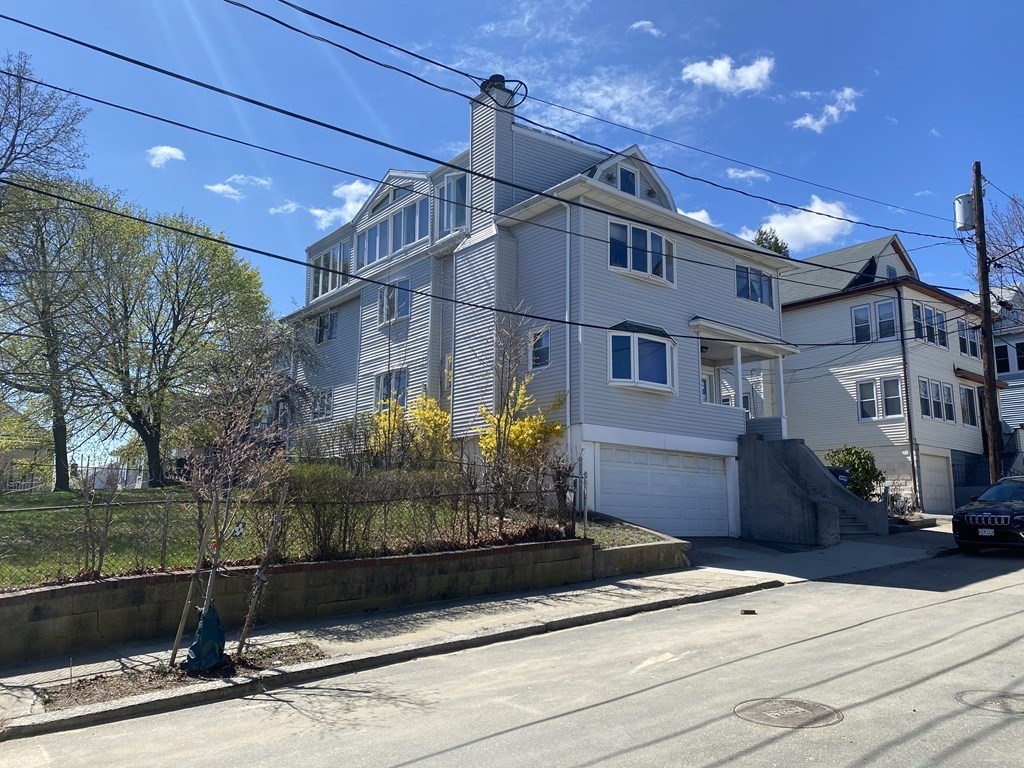 16 Putnam Road Somerville, MA 02145 - Photo 2 of 23 a front view of a house with garden