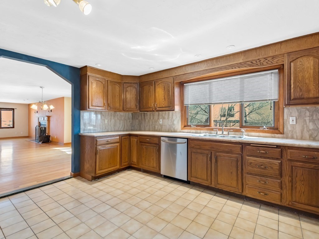 16 Putnam Road Somerville, MA 02145 - Photo 5 of 23 a kitchen with a sink cabinets and window
