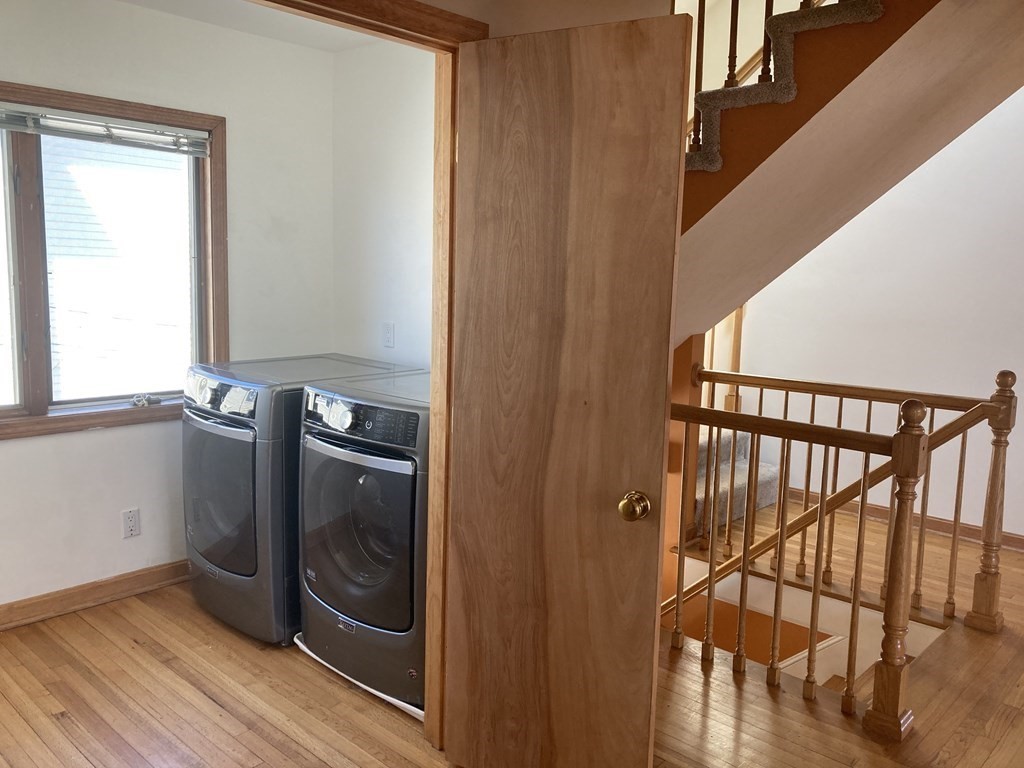 16 Putnam Road Somerville, MA 02145 - Photo 6 of 23 a view of a hallway with wooden floor and staircase