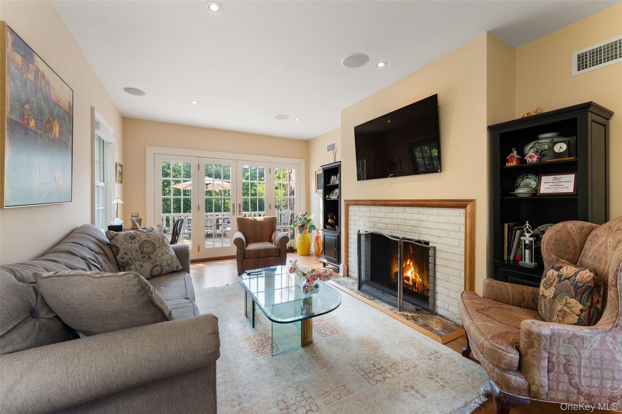 5 Cooper Road Scarsdale, NY 10583 - Photo 6 of 46 Library/office with french doors and wood burning fireplace