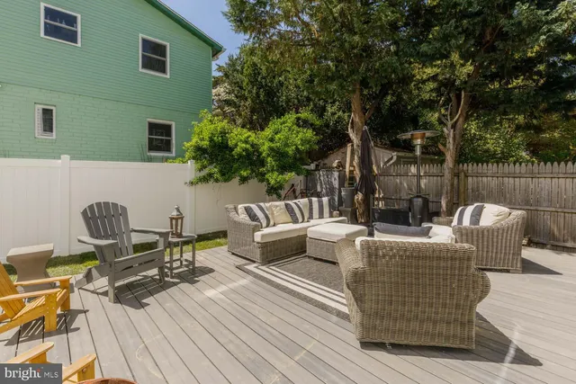 a bedroom with a large bed and a flat screen tv