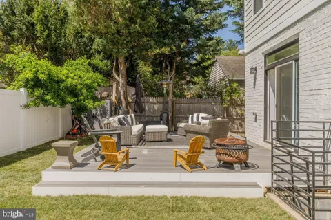 a bathroom with a double vanity sink mirror and shower