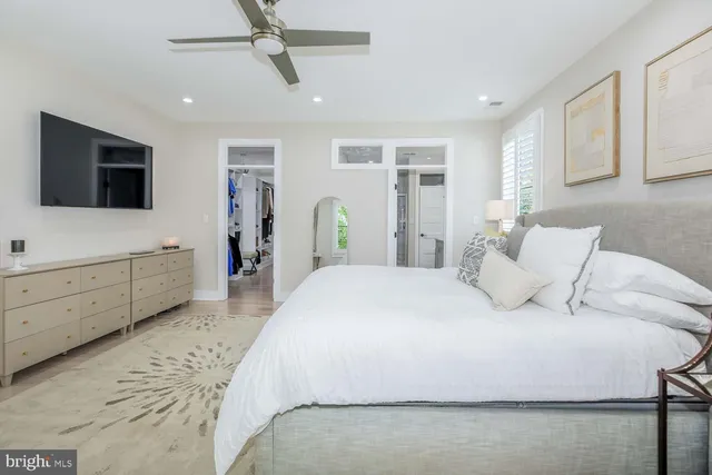 a bedroom with a bed and a table