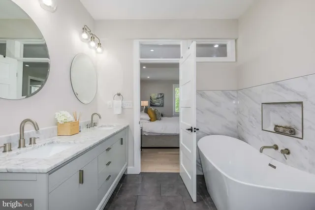 a bathroom with a bathtub and shower