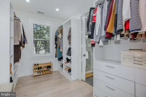 a bed room with a bed and a window