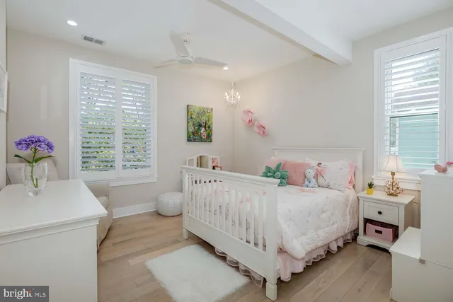a living room with furniture and flowers