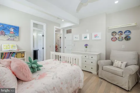 a bedroom with a bed and a table in it