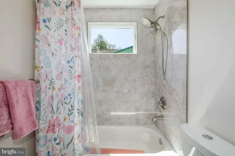 a view of a storage & utility room with washer and dryer