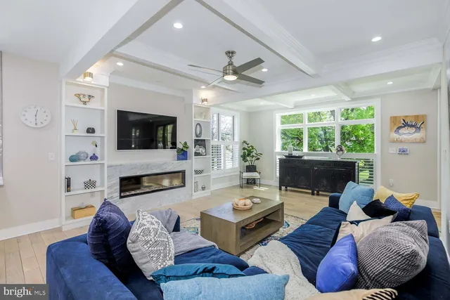 a kitchen with stainless steel appliances granite countertop a stove a sink a microwave a dining table and chairs