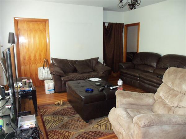 120 Reeves Street Fall River, MA 02721 - Photo 4 of 9 a living room with furniture and a flat screen tv