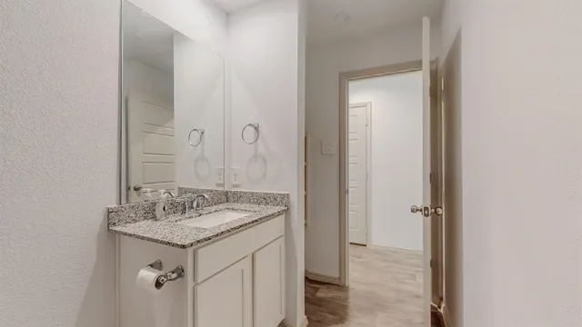 a bathroom with a toilet and a shower curtain