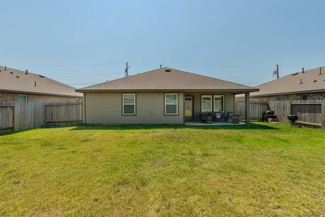 a view of living room with furniture and rug