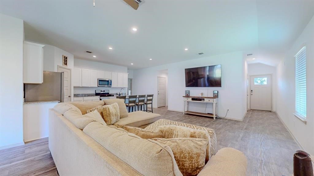6710 Riplee Street Beaumont, TX 77708 - Photo 4 of 27 a living room with furniture and a couch
