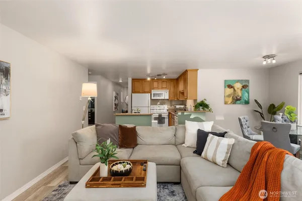 a living room with furniture and a chandelier