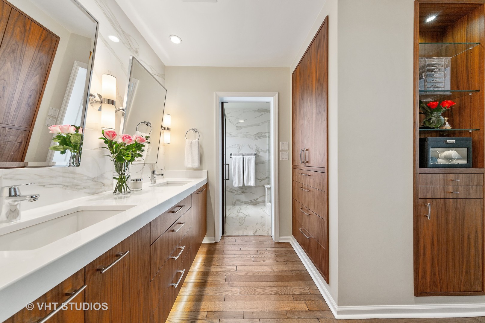 1308 North Sutton Place Chicago, IL 60610 - Photo 14 of 29 a bathroom with a double vanity sink and a mirror