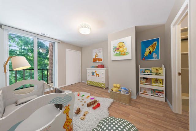 1308 North Sutton Place Chicago, IL 60610 - Photo 22 of 29 a living room with baby crib furniture and a large window