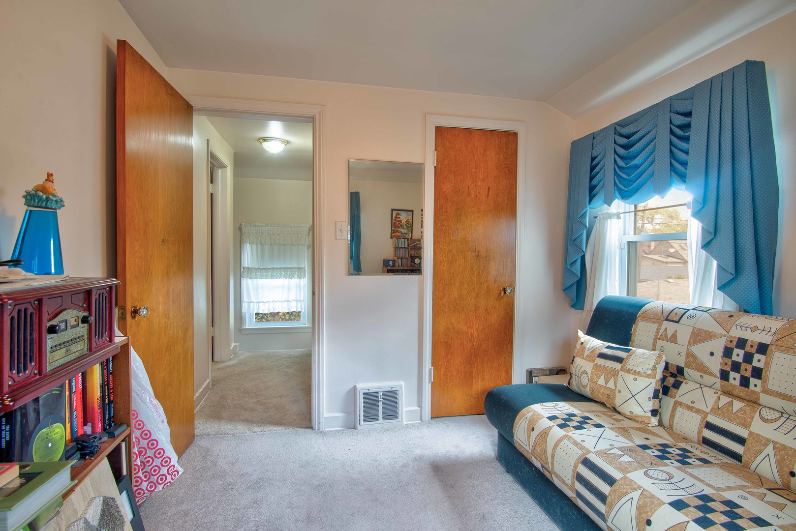 2441 Clarke Street River Grove, IL 60171 - Photo 13 of 25 a living room with furniture and a book shelf