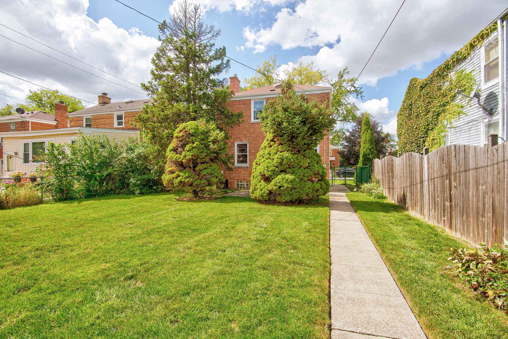 2441 Clarke Street River Grove, IL 60171 - Photo 19 of 25 a view of a garden with a building