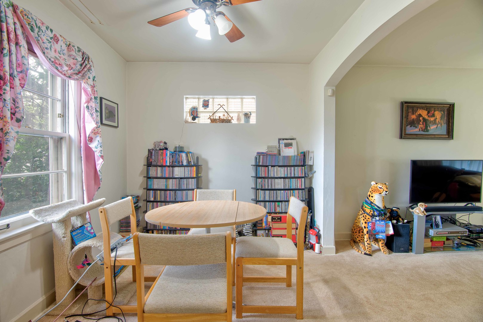 2441 Clarke Street River Grove, IL 60171 - Photo 6 of 25 a living room with furniture a flat screen tv and a large window