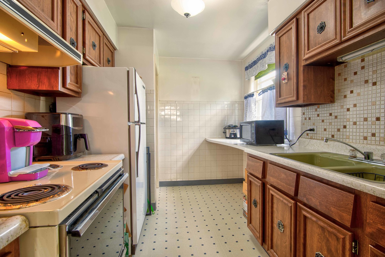 2441 Clarke Street River Grove, IL 60171 - Photo 7 of 25 a kitchen with stainless steel appliances granite countertop a sink stove and cabinets