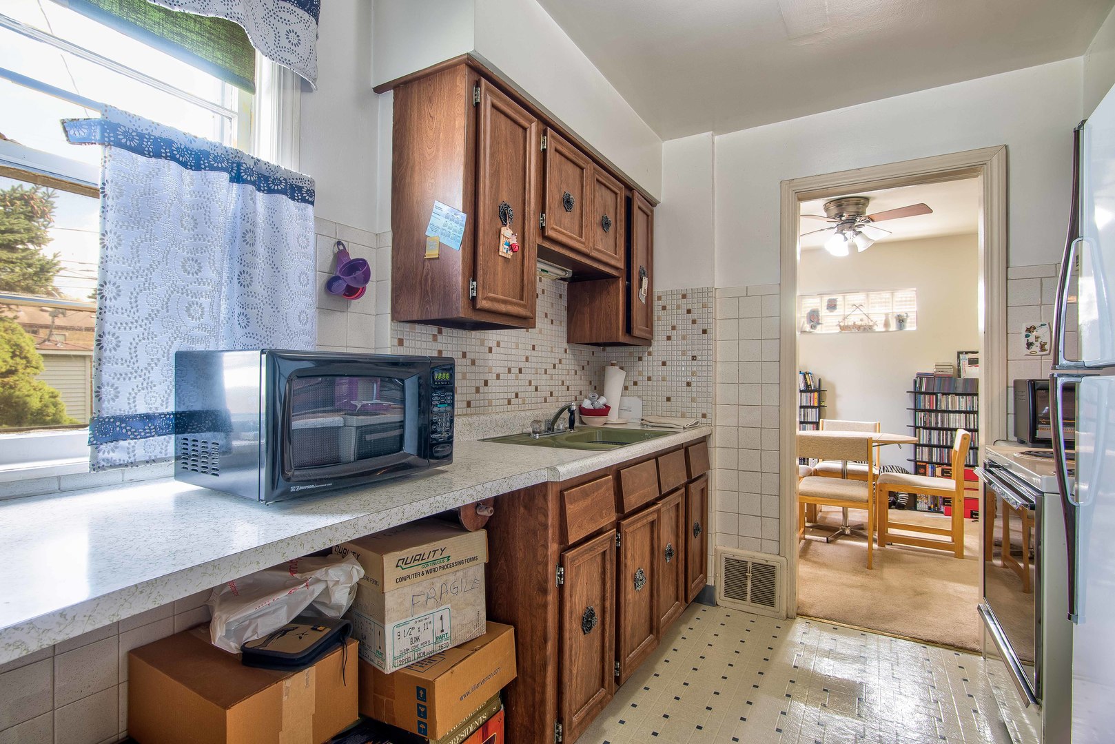 2441 Clarke Street River Grove, IL 60171 - Photo 8 of 25 a kitchen with stainless steel appliances granite countertop a barbecue stove and cabinets