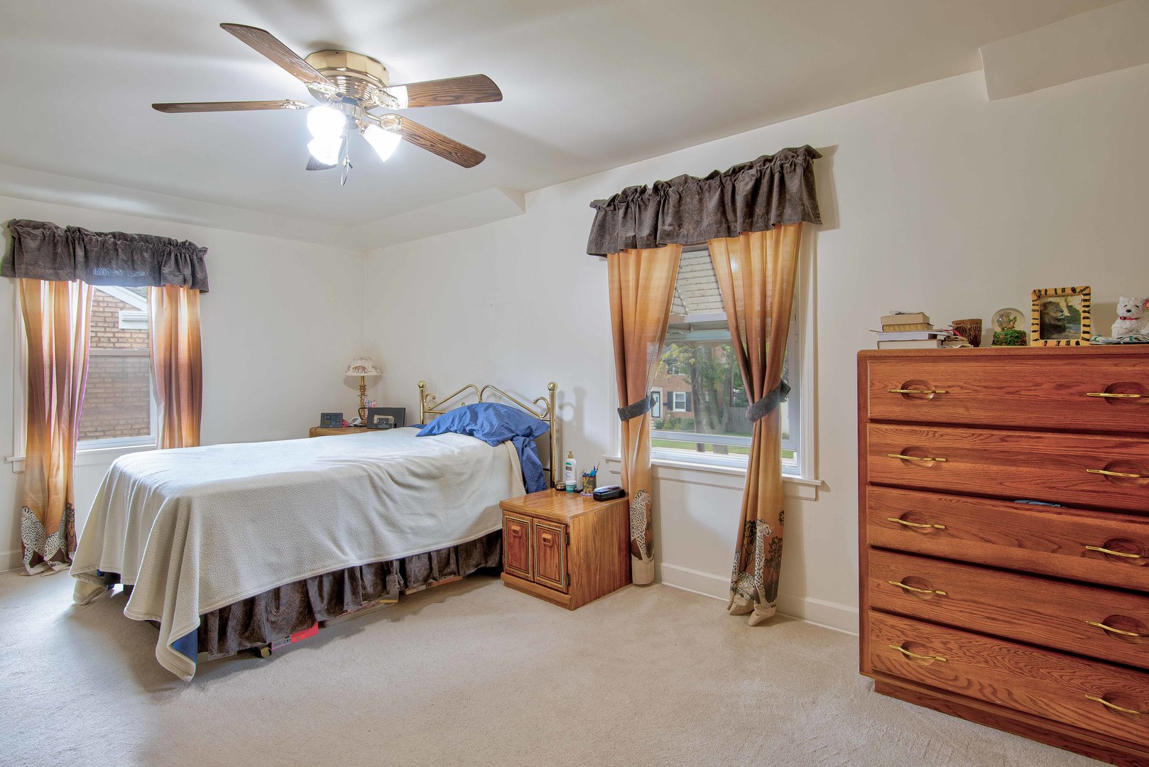 2441 Clarke Street River Grove, IL 60171 - Photo 10 of 25 a bedroom with a bed and a chandelier