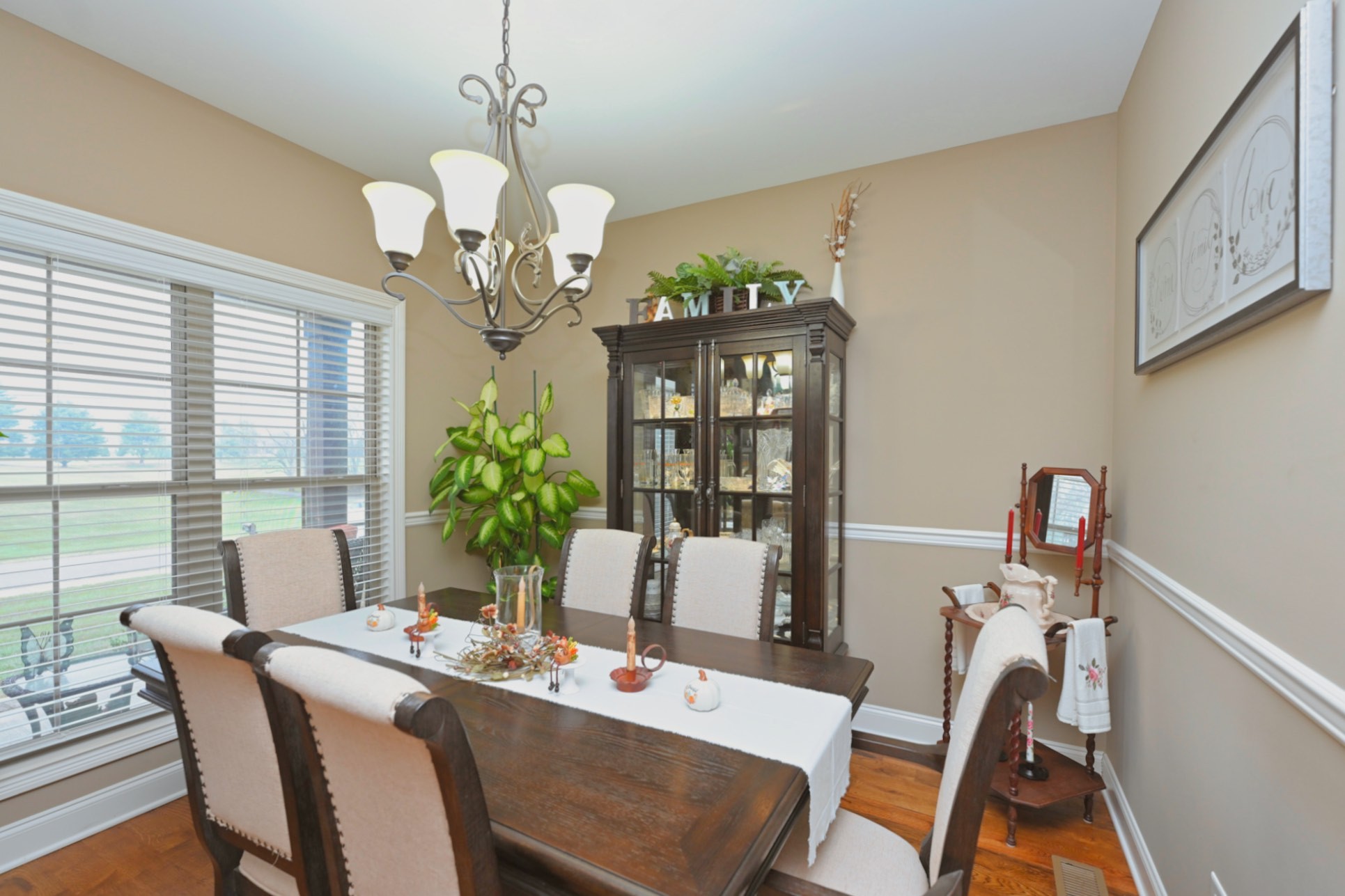 727 North Russell Street Portland, TN 37148 - Photo 27 of 72 a view of a dining room with furniture wooden floor and chandelier
