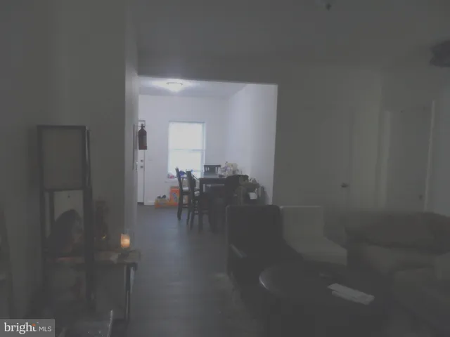 a view of a hallway with seating area