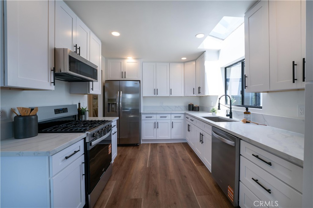 675 Huntington Road Cambria, CA 93428 - Photo 11 of 30 a large kitchen with stainless steel appliances granite countertop a stove sink and cabinets