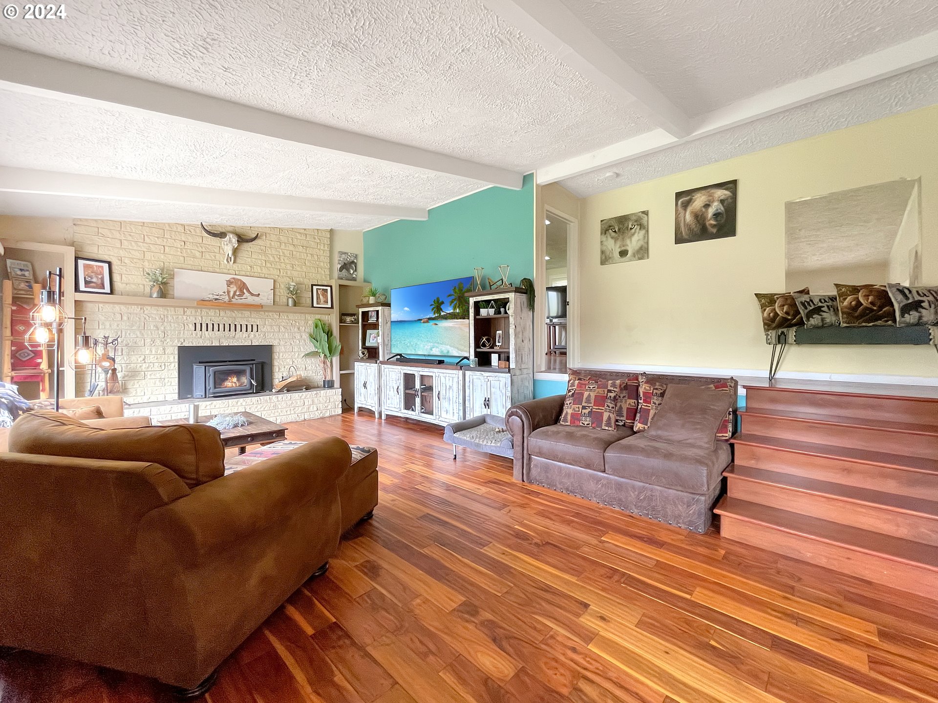 17676 Gardner Ridge Road Brookings, OR 97415 - Photo 15 of 42 a living room with furniture and a fireplace