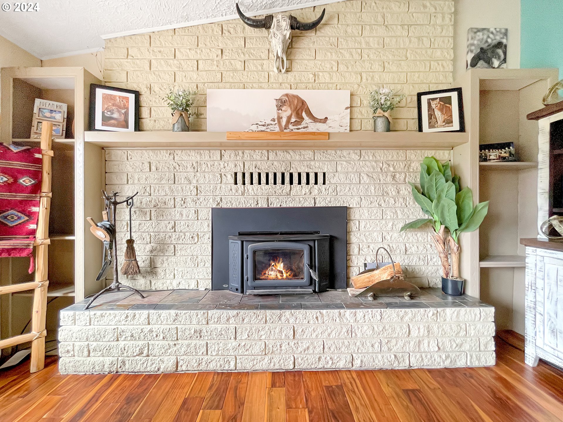 17676 Gardner Ridge Road Brookings, OR 97415 - Photo 18 of 42 a living room with furniture and a fireplace