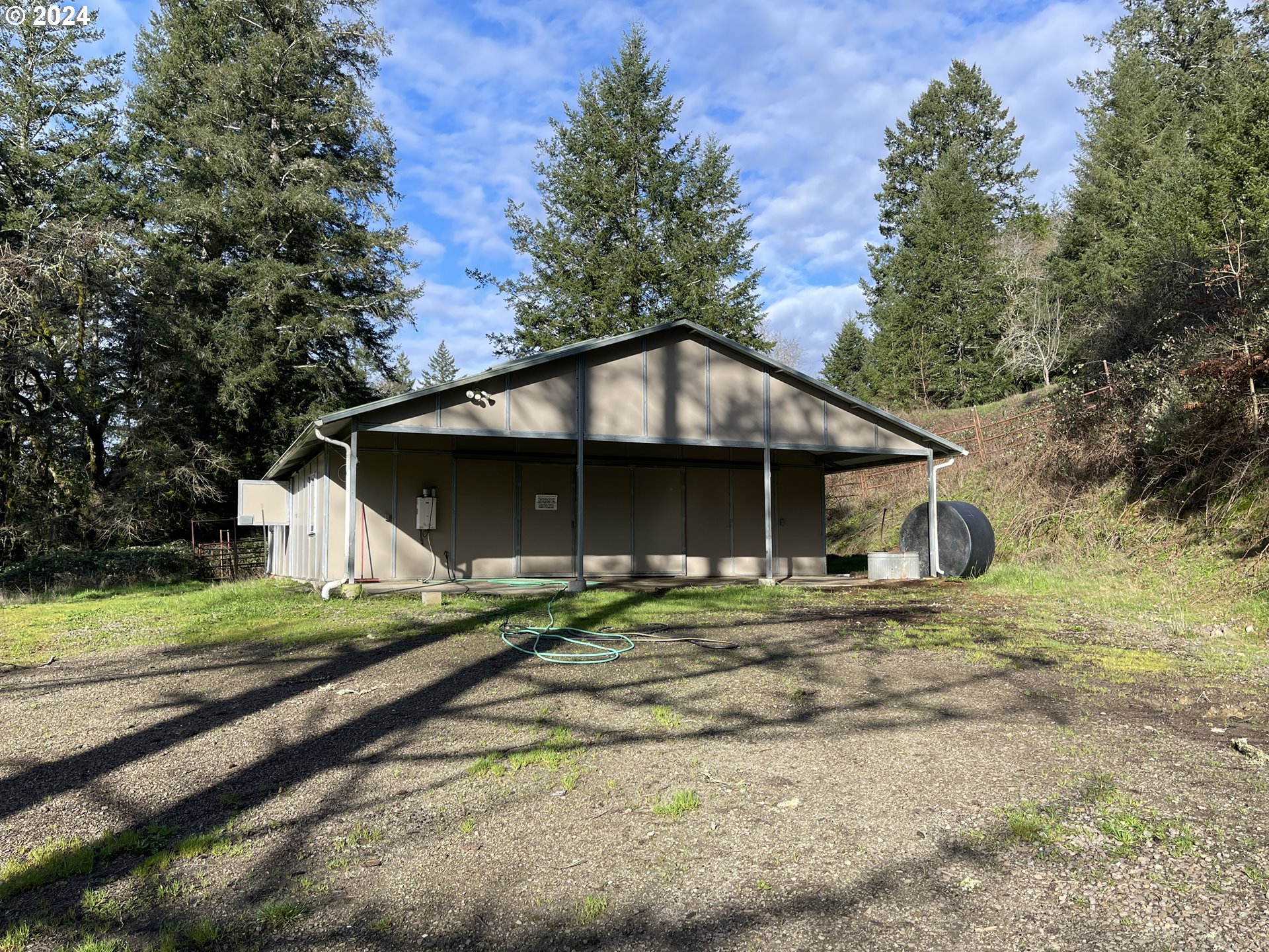 17676 Gardner Ridge Road Brookings, OR 97415 - Photo 42 of 42 a view of a house with a yard