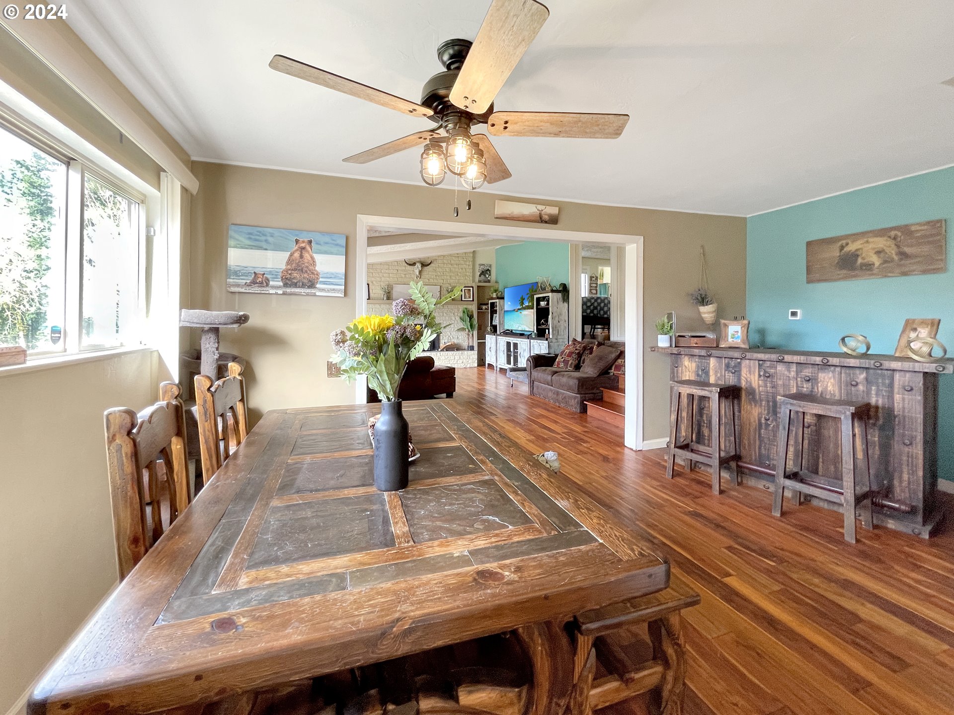 17676 Gardner Ridge Road Brookings, OR 97415 - Photo 10 of 42 a view of a dining room with furniture window and wooden floor