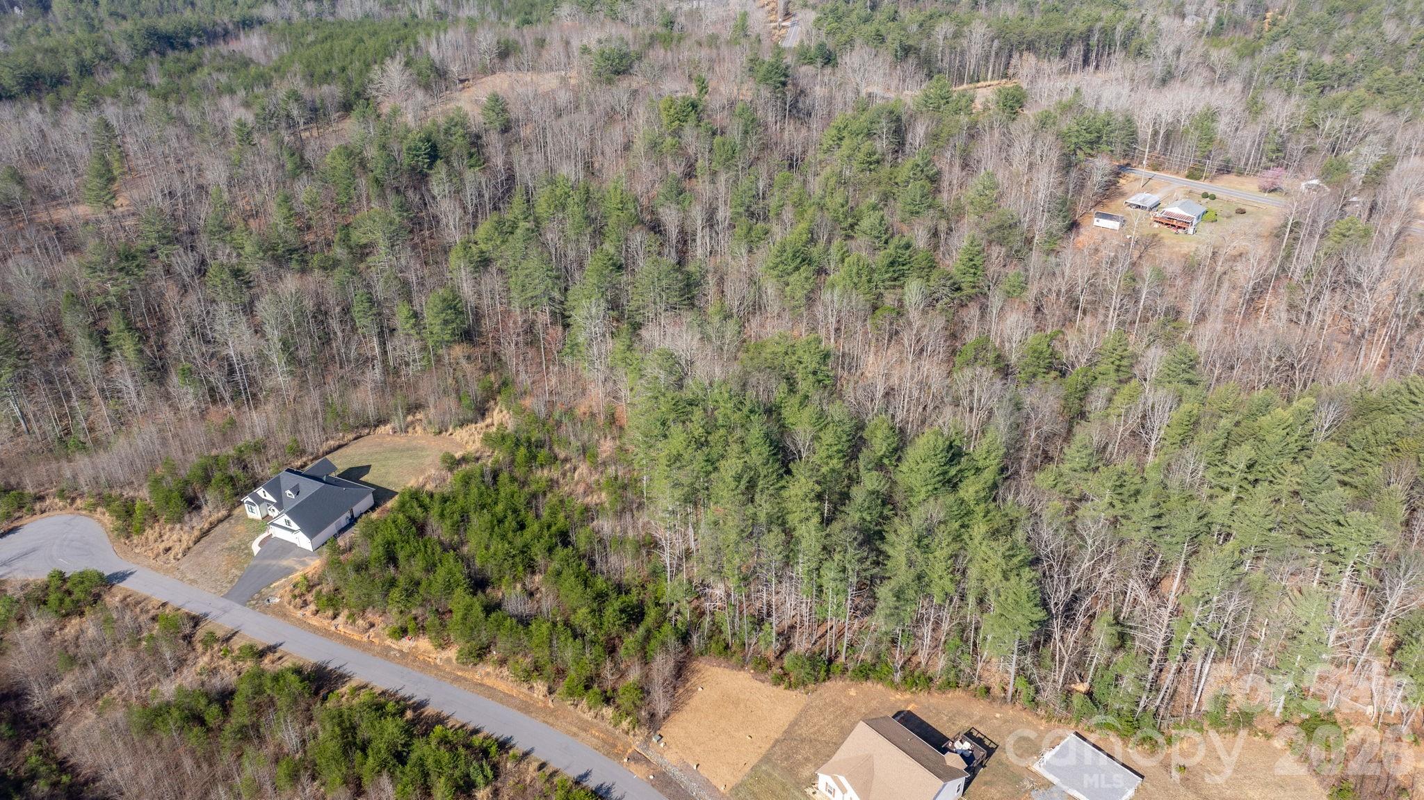 2084 Starlight Lane Morganton, NC 28655 - Photo 13 of 28 a view of a yard and basketball court