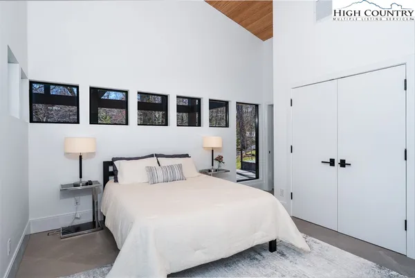 a en suite bathroom with a double vanity sink and a mirror
