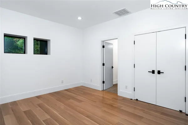 a view of a patio with table and chairs potted plants with wooden fence