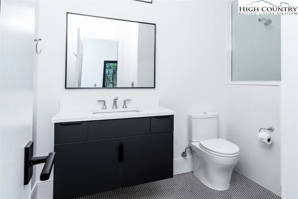 a backyard of a house with a table and chairs