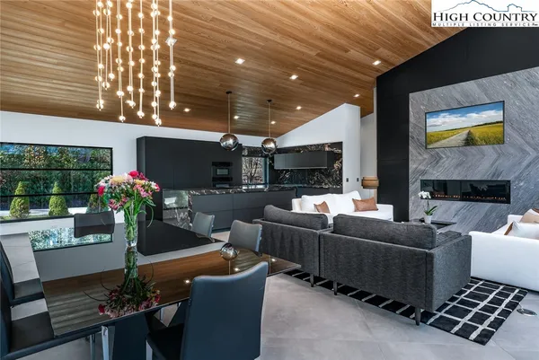 a living room with fireplace furniture and a flat screen tv