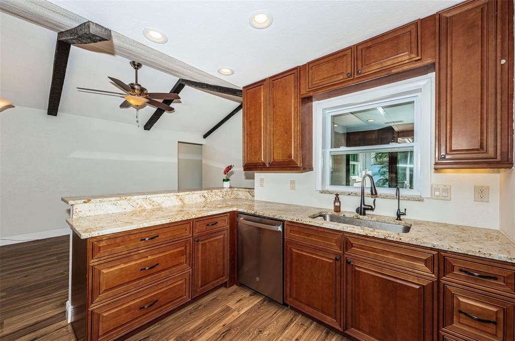 4723 114th Street North Madeira Beach, FL 33708 - Photo 11 of 41 a kitchen with a sink and cabinets