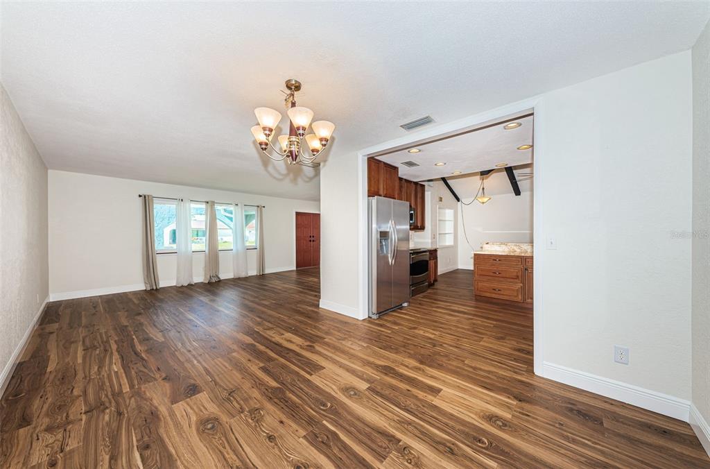4723 114th Street North Madeira Beach, FL 33708 - Photo 16 of 41 a view of a room with wooden floor and stairs