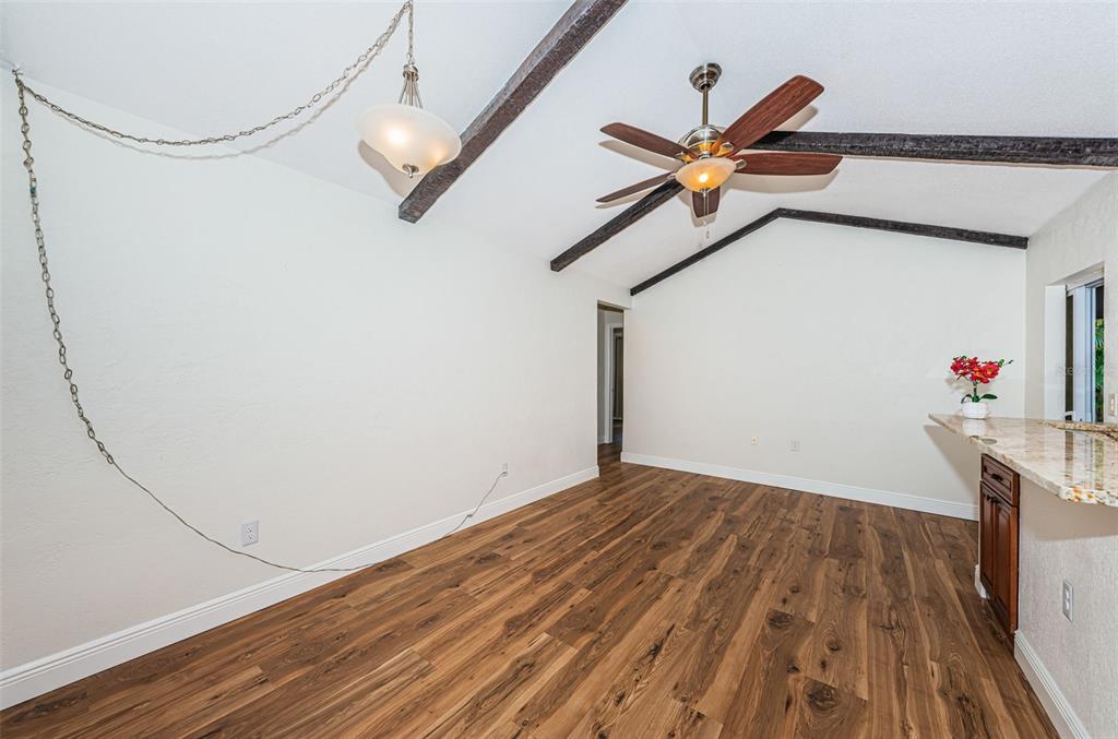 4723 114th Street North Madeira Beach, FL 33708 - Photo 19 of 41 a view of a hallway with wooden floor
