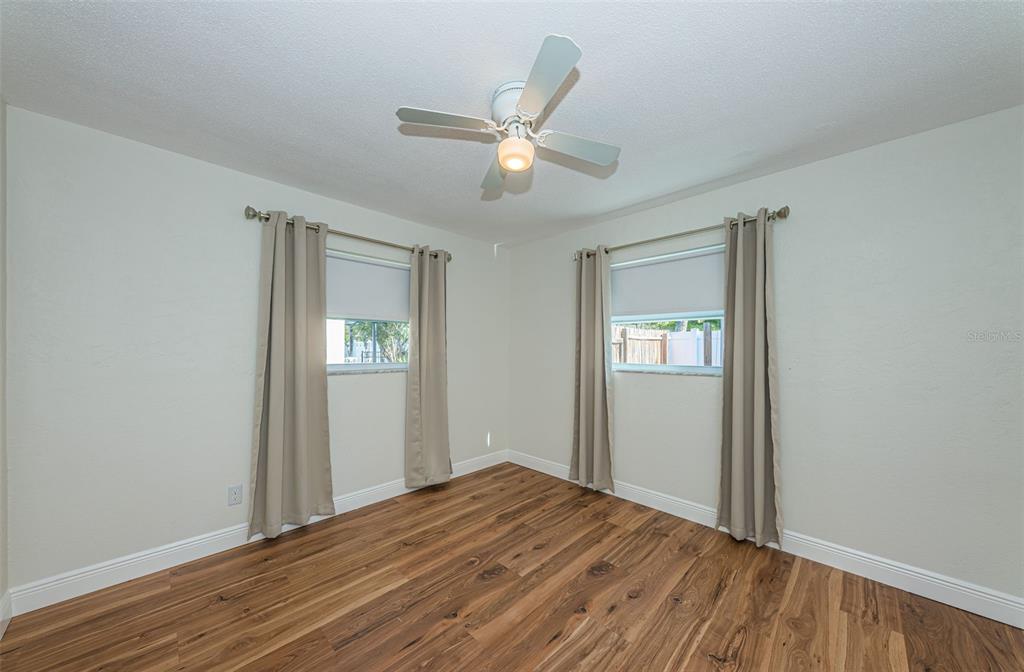 4723 114th Street North Madeira Beach, FL 33708 - Photo 34 of 41 a view of empty room with wooden floor