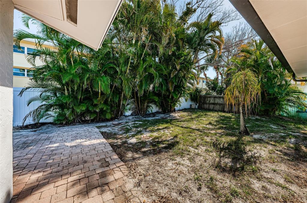 4723 114th Street North Madeira Beach, FL 33708 - Photo 37 of 41 a view of a yard with plants and trees