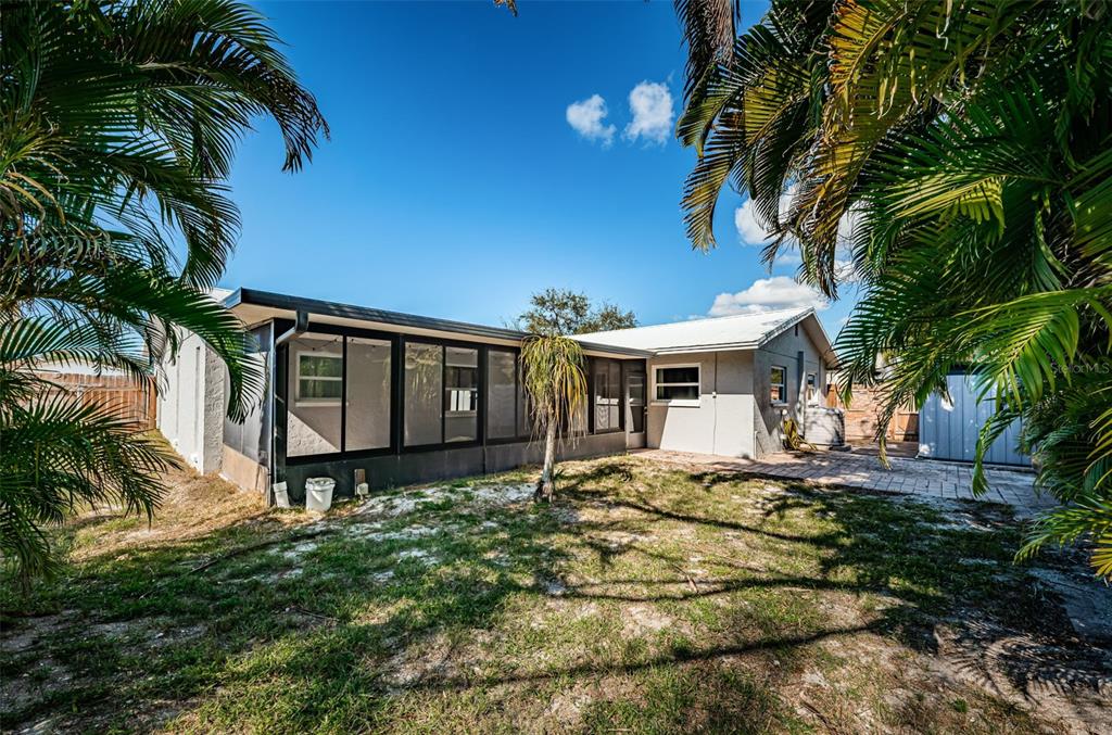 4723 114th Street North Madeira Beach, FL 33708 - Photo 39 of 41 a front view of a house with garden