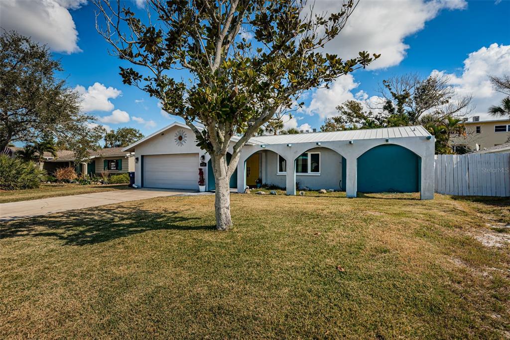4723 114th Street North Madeira Beach, FL 33708 - Photo 41 of 41 a house with trees in the background
