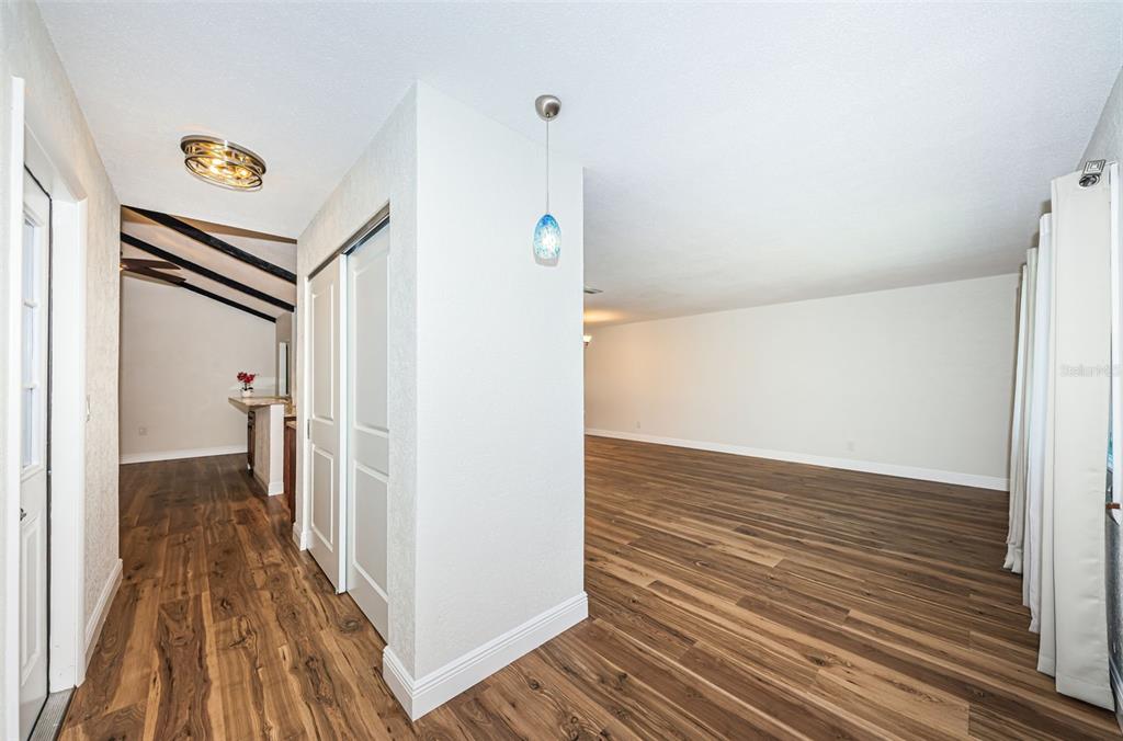4723 114th Street North Madeira Beach, FL 33708 - Photo 6 of 41 a view of a hallway with wooden floor